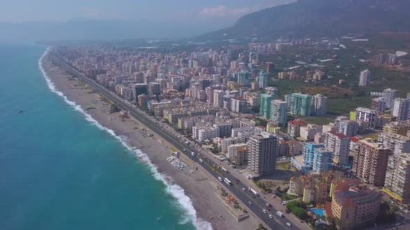 A Large City Located on a Mountain View From a Drone