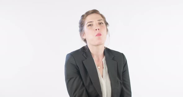 Woman eating a red apple on a white studio background