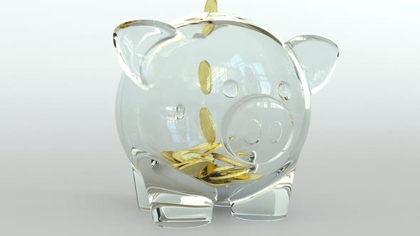 Golden Coins Fall Into Transparent Piggy Bank