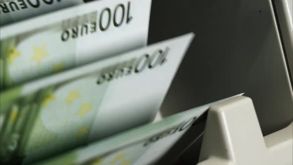 Calculating Machine for Money Counting One Hundred Euro Banknotes Closeup