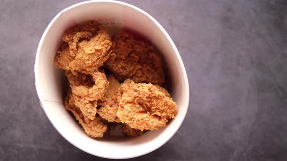 Fried Chicken Fillets in a Take Away Bowl on Black