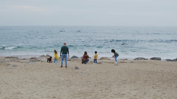 Happy Family Weekend On Beach