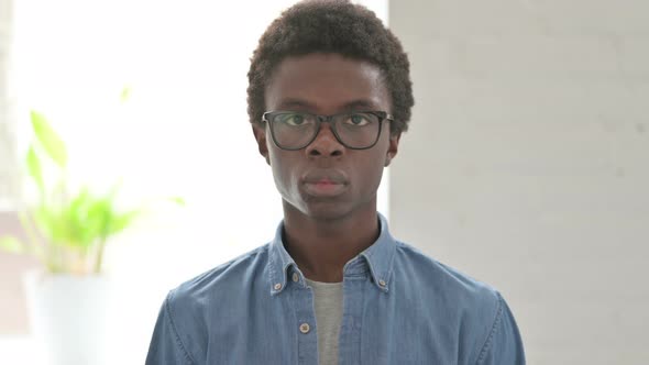 Portrait of Young African Man Looking at the Camera