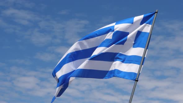 Greece Flag Waving in the Wind in Slow Motion Close Up with Sky Background