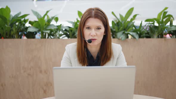 Call Center Operator Talking to Customer