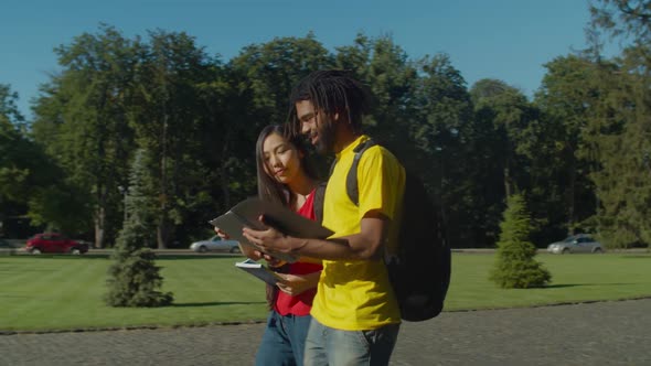 Multiracial Couple Going To University Course