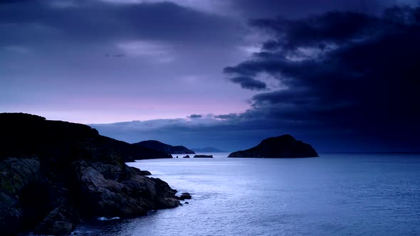 Timelapse. Dark Clouds over Sea Coast at Evening