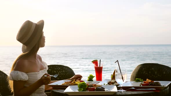 Beautiful Girl Eat at Seaside Restaurant Breakfast Table Luxury Travel Woman