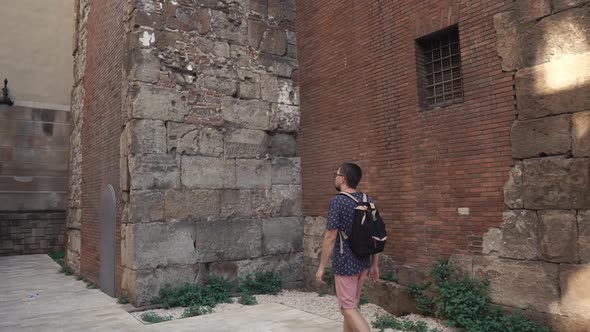 Man in a City By the Old Building.