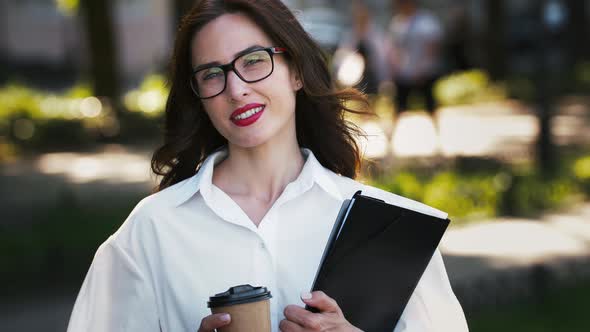 Businesswoman in Glasses and White Shirt