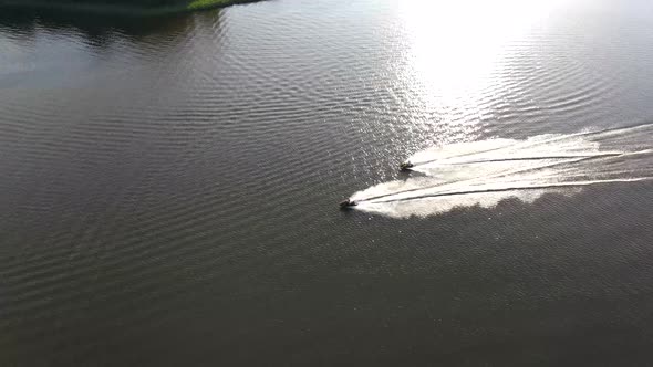 A two jet ski race on Jeziorak Lake in Poland