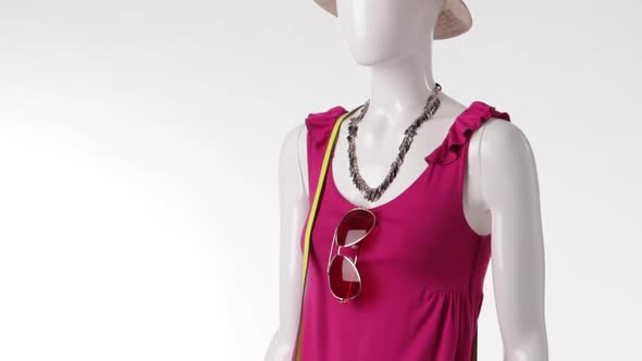 Female Mannequin in Pink Top.