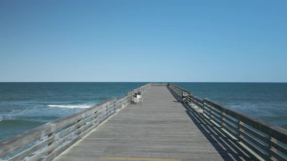 Beautiful symmetrical tracking shot of Crystal Pier, Wrightsville Beach North Carolina