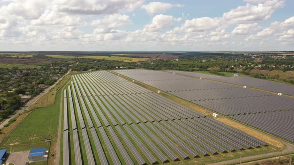 Aerial view of the Solar panels on a hill above the river