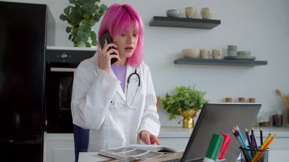 Woman Doctor with Ultrasound Scan Giving Medical Advice to Patient Using Phone