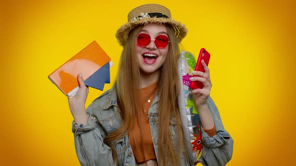 Teenager Girl Tourist with Mobile Phone Celebrating Winning Holiday Resort Vacation Tickets Pass