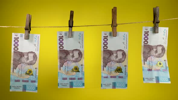 Ukrainian Currency is Dried on a Rope