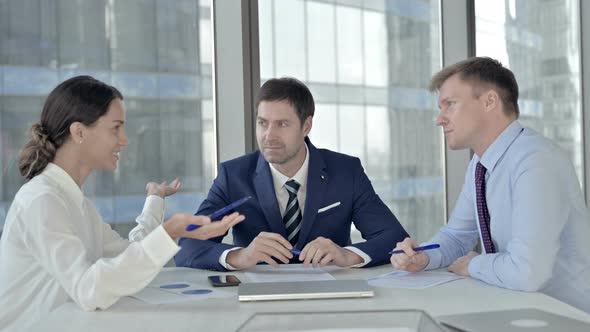 Executive Business People Having Meeting on Boardroom Table