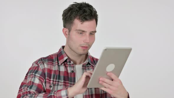 Portrait of Young Man Celebrating Success on Tablet