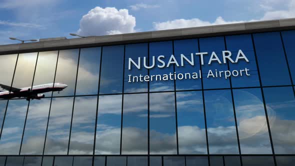 Airplane landing at Nusantara Indonesia airport mirrored in terminal