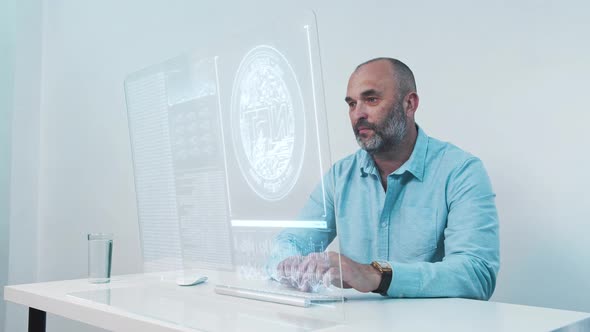 Man Working with NFT Data on Desktop Computer
