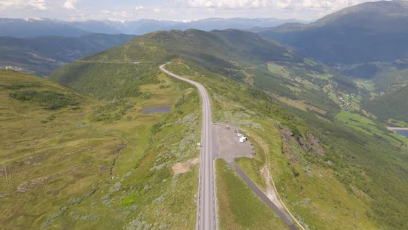 Cinematic reveal of stunning mountain road on top of mountain; drone flight