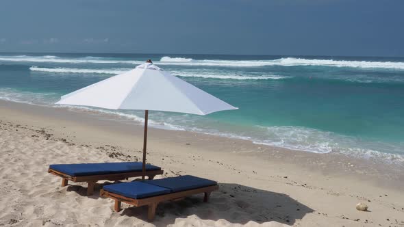 Beach Chair and Umbrella on Tropical Sand Beach