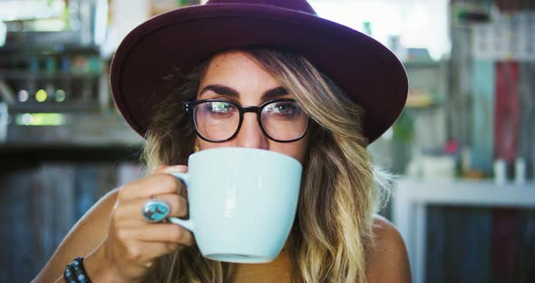 Young Woman Drinking Coffee