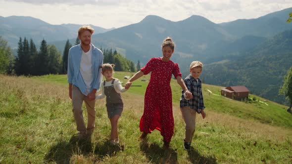 Carefree Family Stroll Mountain Slope Summer Holiday