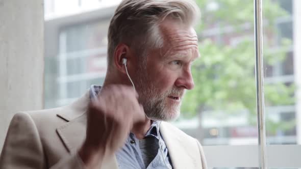 Businessman having phone call in coffee shop