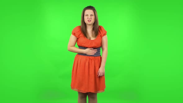 Cute Girl Is Feeling Very Bad, Her Stomach Hurting . Green Screen