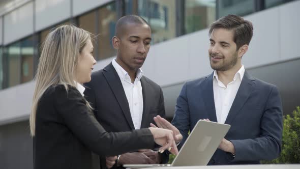 Positive Confident Business Colleagues Discussing Project