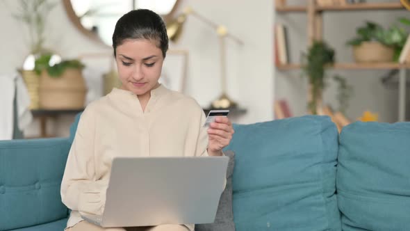 Online Shopping Failure on Laptop By Indian Woman on Sofa