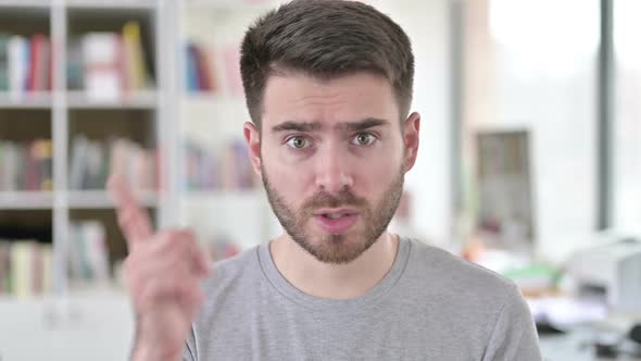 Portrait of Annoyed Young Man Arguing Fighting