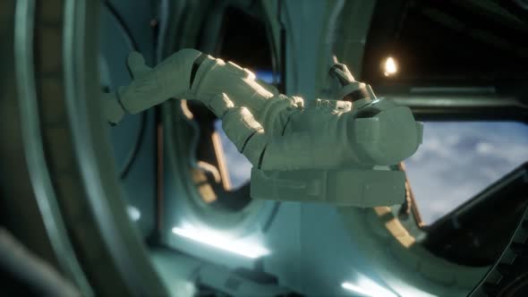 Astronaut Inside the Orbital Space Station