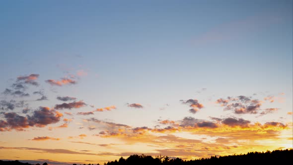 Sunset Orange Clouds Move Over Forest