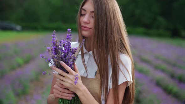 Happy Girl Posing with Lavender Bouquet in Field