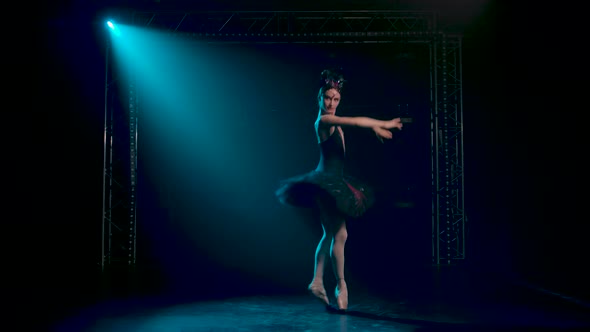 Classical Ballet Choreography Perfoming By Young Beautiful Graceful Ballerina in Black Tutu. Dark