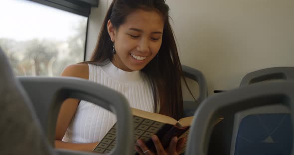 Teenage girl reading a book 4k