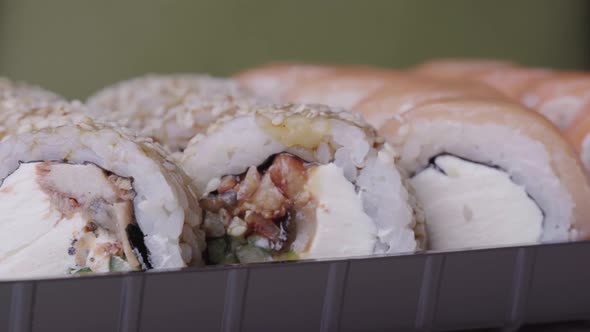 Sushi Roll Turned on a Green Background