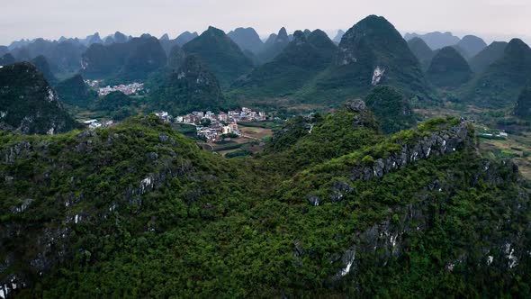 Aerial of the rock formations and towns along the Li River in China