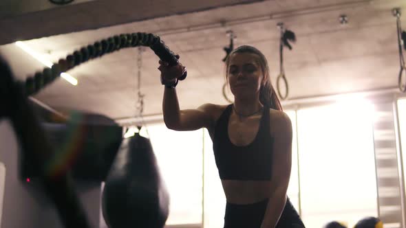 Footage of Female Battle Ropes Workout