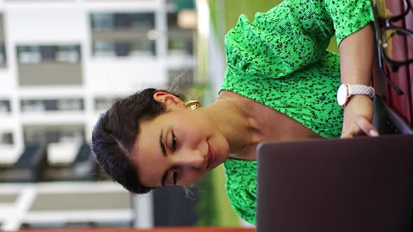 Caucasian Woman Working with Laptop Computer Outside Office