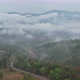 Aerial landscape view of greenery rainforest and hills on foggy day by drone - VideoHive Item for Sale