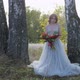 A Young Woman Dressed in a Gray Wedding Dress Celebrates Her Wedding. She Has Flowers in Her Hand - VideoHive Item for Sale