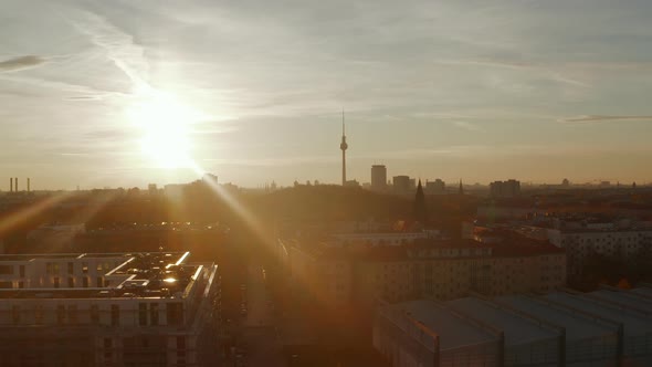 Slow Lowering Crane Down Above Residential Street in Berlin, Germany Neighbourhood at Golden Hour