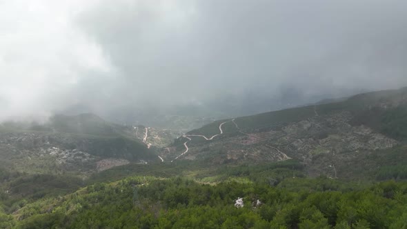 Foggy road in the mountains aerial view 4 K