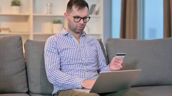 Young Man Having Online Payment Failure on Laptop 