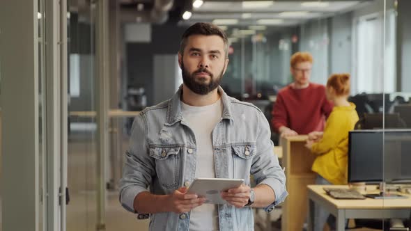 Portrait Of Modern Office Worker With Tablet