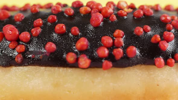 Close-up slider motion donuts. Closeup of delicious sweet multicolored donuts on colorful background